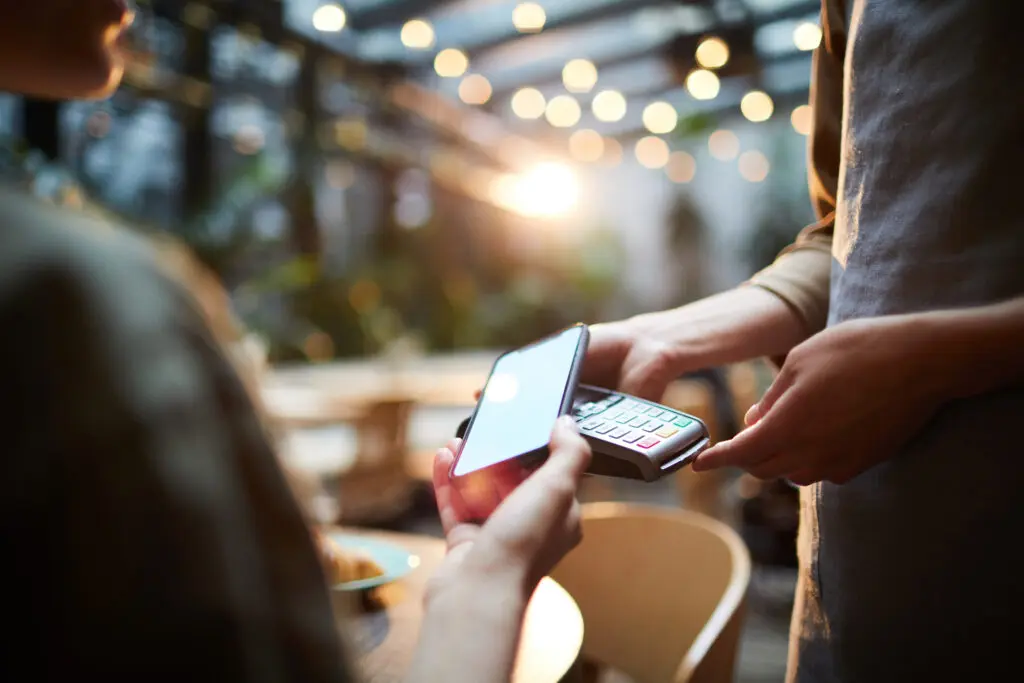 small business owner making a transaction with a customer
