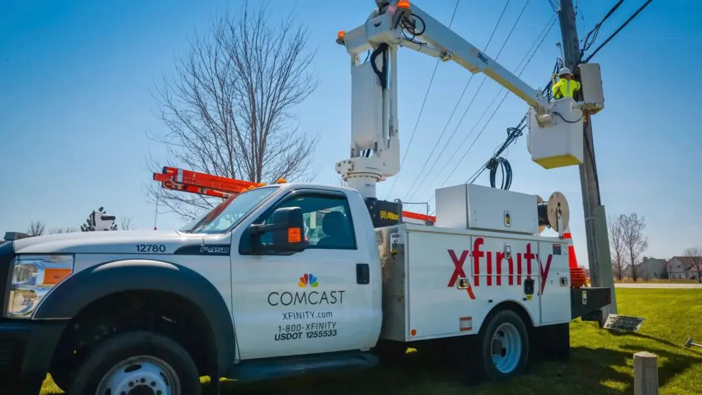 An Xfinity tech works in a bucket truck to bring fast fiber internet to local homes and businesses.